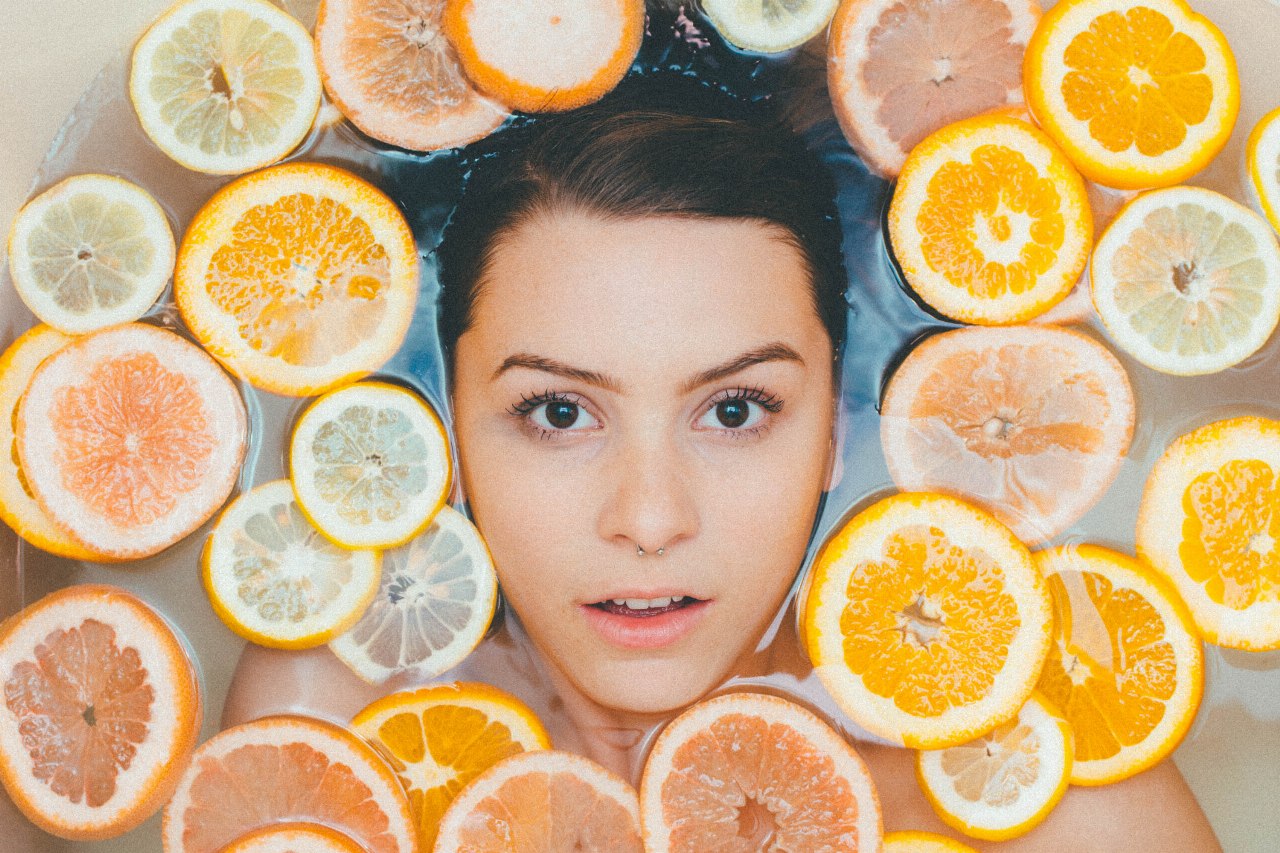 Pretty Belarus Brides - cover - a woman among oranges and lemons